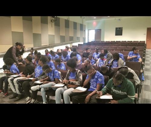 students sitting in the auditorium 